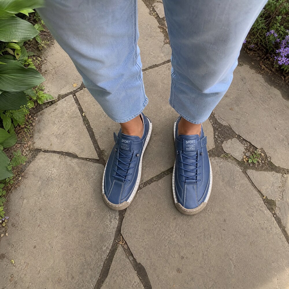 Customer wearing navy Rosie's Easy Steps sneakers on her patio