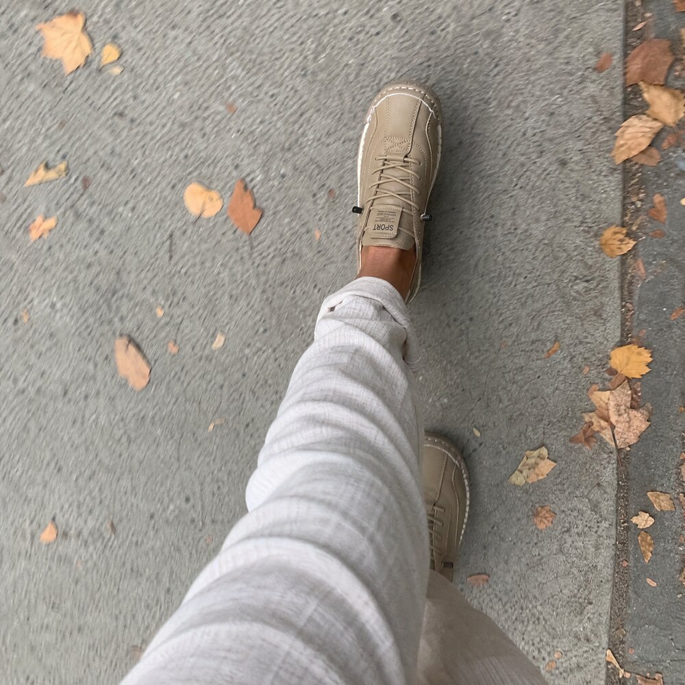 Customer wearing beige Rosie's Easy Steps sneakers on an autumn walk
